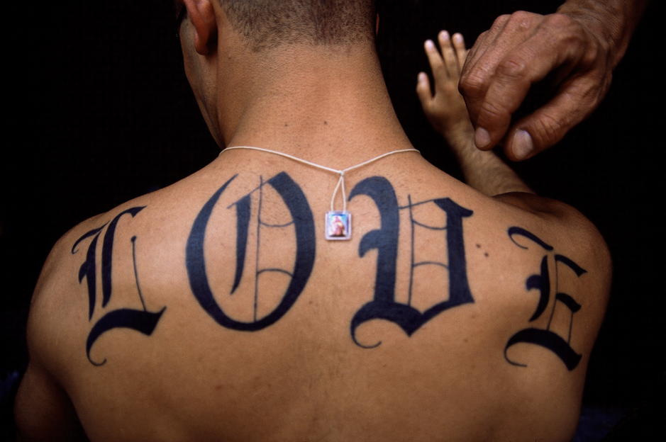 The word "LOVE" tattoed on a man's back in New York City. Happy Valentine's Day. [Photo of the day - FEBRUARY 14, 2011]