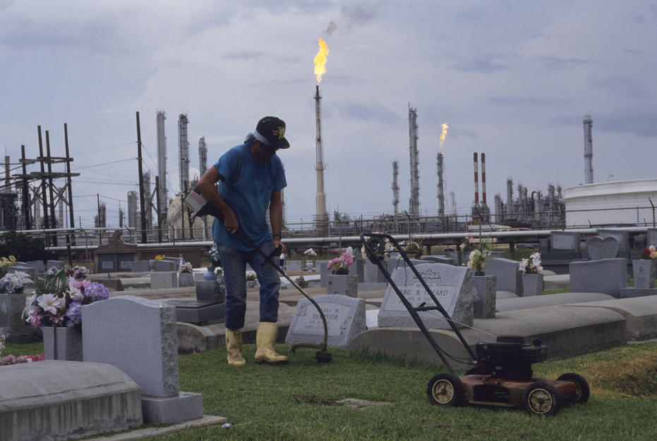 A man cuts the grass at a cemetary in an area known as Cancer Alley in Morrisonville, Louisiana. [Photo of the day - FEBRUARY 27, 2011]