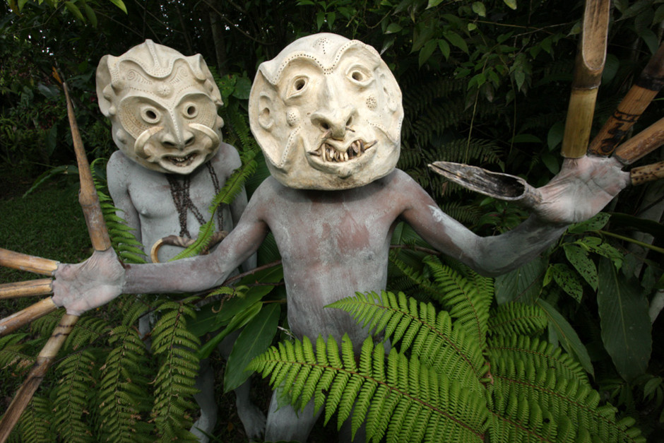 Mudmen from the Waghi Valley Area pose in the shrubbery. Body painting with mud is one of many indig... [Photo of the day - 21 FEBRUARY 2012]